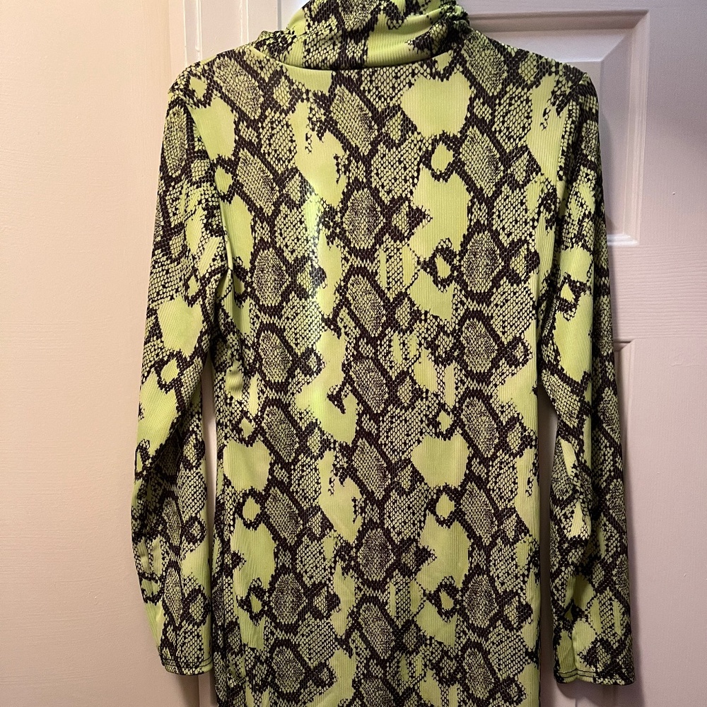 Turtleneck neon and black body con dress